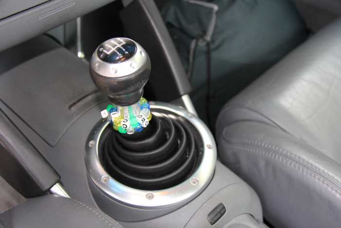Sports car-driving is a terrible time to be lazy! If you can, row those gears to keep the engine in its peak powerband (where it can spread the load between the engine, turbo, and gearing — not just the turbo).