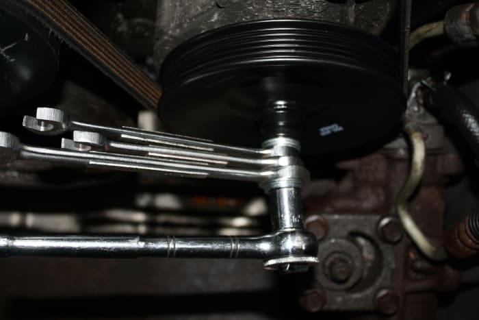 Five washers weren't enough. I added one, then two, then three open end wrenches as the pulley was pressed onto the pump shaft.