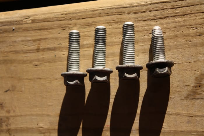 Pump mounting bolts. Three alternator/PS bracket-to-pump bolts and one rear-bracket-to-engine-block bolt.