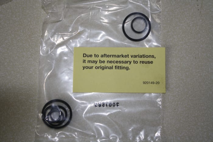 Two sets of pump-to-reservoir seals for different applications. Use the ones that are slightly taller than the recess so they will press tight against the reservoir body when assembled.