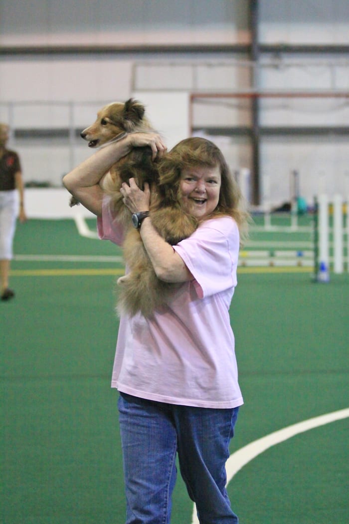 The author celebrating a clean run with her sheltie, Aslan, while she was in end stage renal failure before receiving her second kidney transplant.