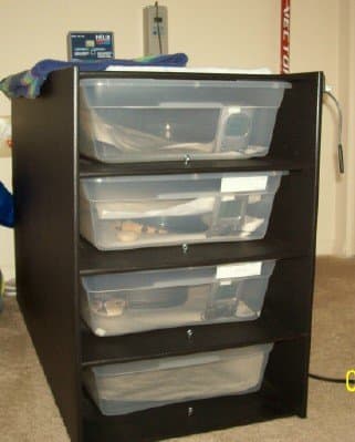 Another great housing option: racks! Tubs fixed in a shelving unit with proper heating and heat regulation attached. Most ball python breeders use these.