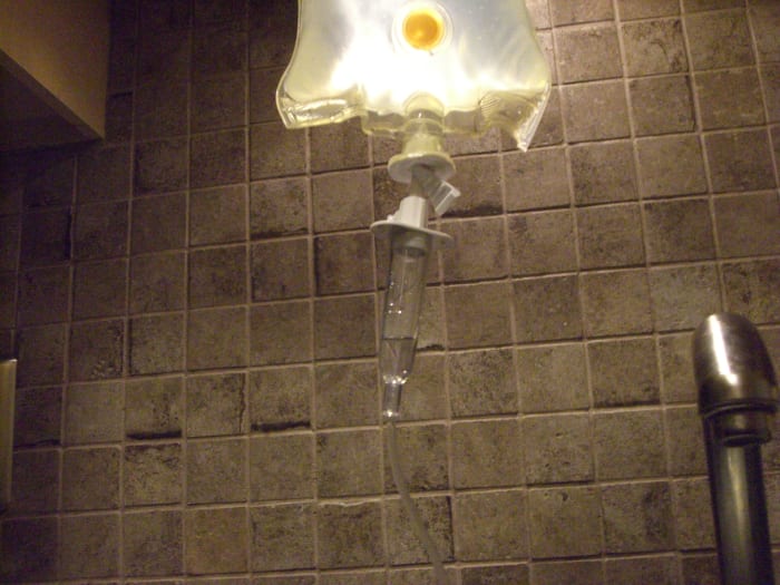The drip chamber; when starting the fluid flow, watch this to measure how fast it's flowing. You want drops—not a steady stream.