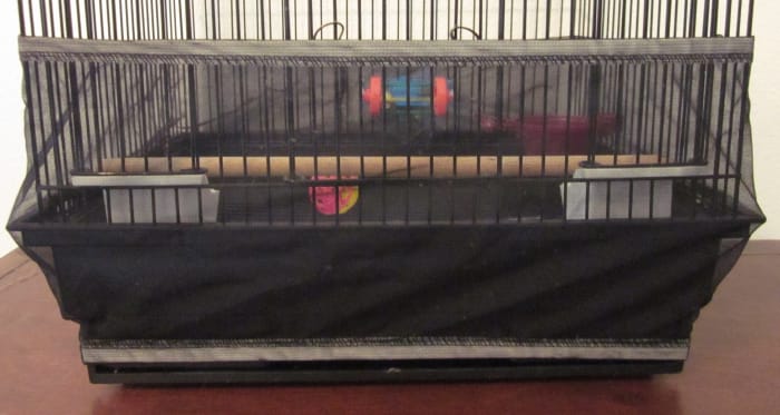 Use a cage skirt to keep your budgie's mess inside the cage.