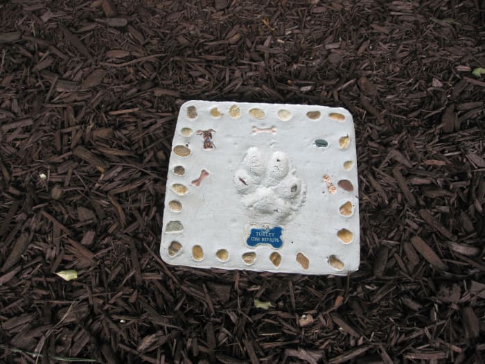 This garden stone, made the day before Turley died, now marks the spot where her ashes are buried.