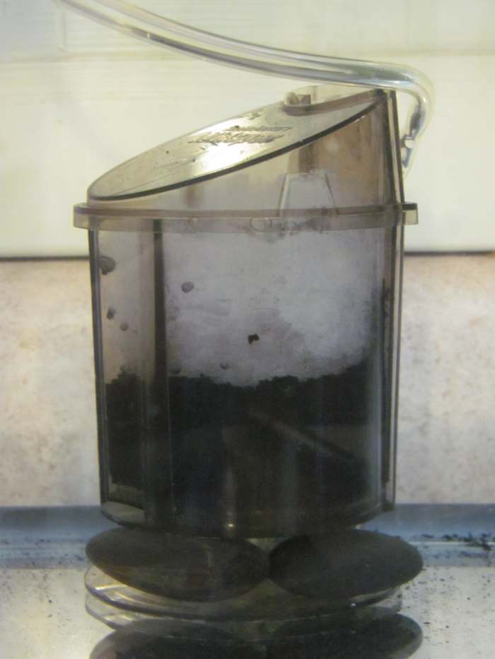 Hate the slanted top but like the permanent stationary piece. If you have no substrate, some smooth rocks will do.