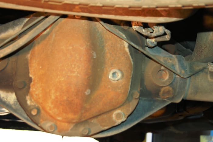 After all the old fluid has drained out, replace the drain plug. Do not over-tighten-it needs to be only snug enough to stop the fluid from leaking out. Go ahead and completely remove the fill plug.