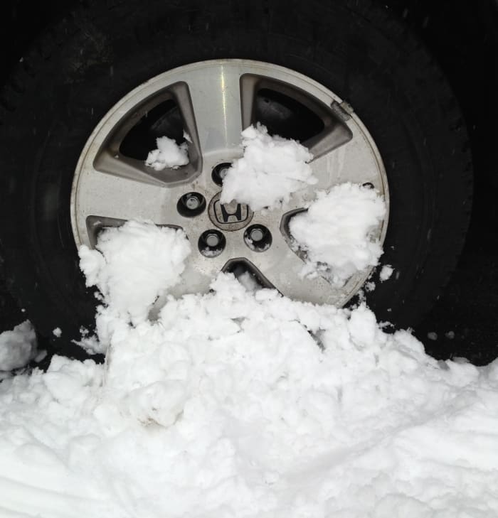 If you drive through a snow bank and have a horrible vibration soon after, check your wheels for packed snow and ice.