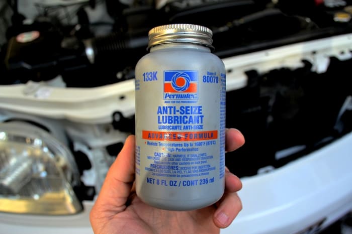A bottle of anti-seize lubricant. Adding this to the spark plug threads will ensure your plugs can be easily removed the next time you change plugs and you don't strip your engine block threads.