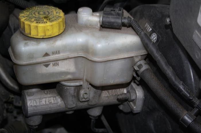 Keep the brake fluid level aove the MIN mark on the reservoir when working and bleeding your brakes.