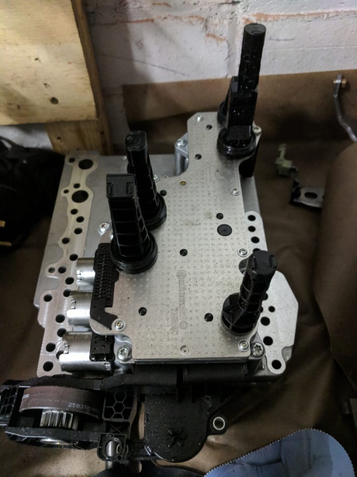 This control module from a Powershift transmission is an example of a mechatronic that is housed inside the transmission itself. Note the black sensors protruding from the back.