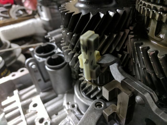 The Powershift automatic transmission uses a magnets to pick up shift fork positions. These sensors can get covered in debris, interfering with proper operation of the transmission.