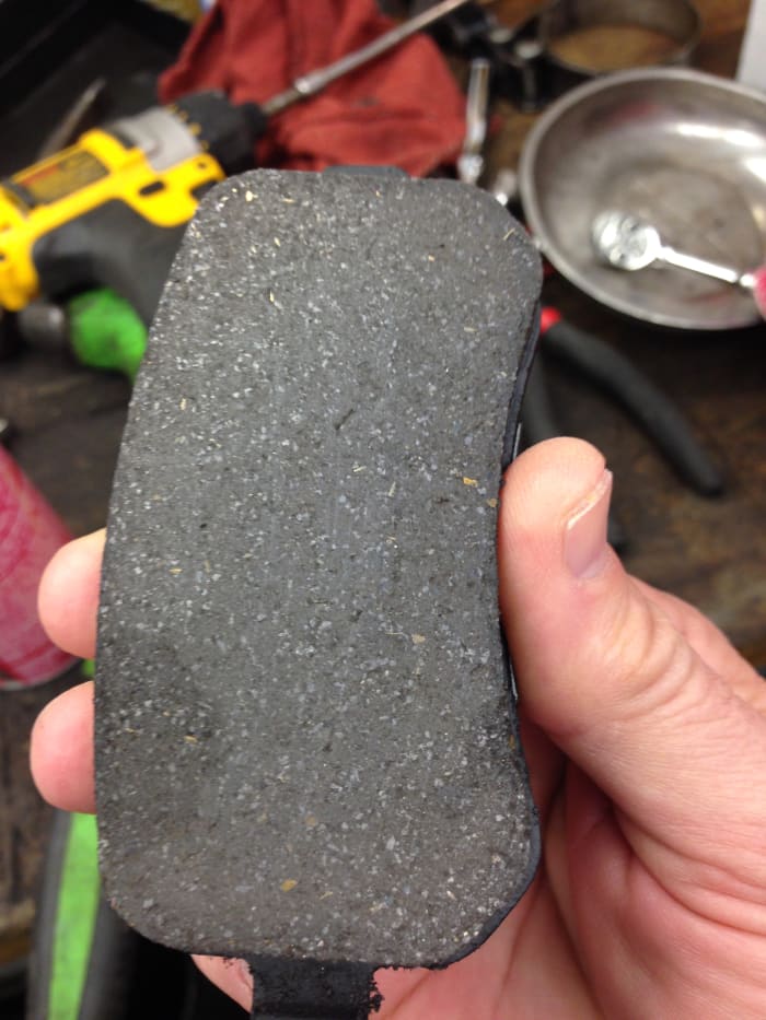 This brake pad has very fine particles of metal embedded in the organic brake material. Particles this fine should not usually cause a brake to squeak.