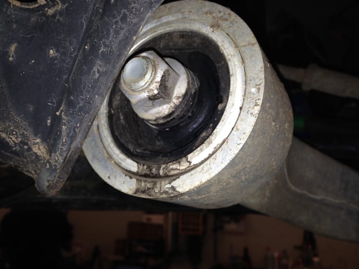 This is a compliance bushing filled with oil, the oil is used as a cushion against vibrations. Once all the fluid leaks out it can start to make a clunking noise.