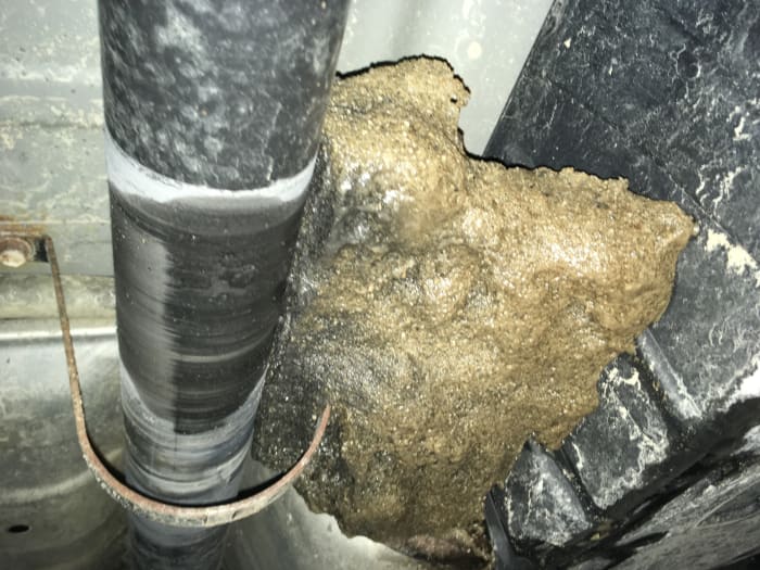 This chunk of ice was jammed against the driveshaft, every time the car started to move it would make a loud thumping noise against the floors.