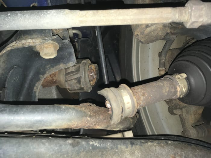 Here is a broken axle shaft, as the shaft started to break it was hitting the lower control arm making a horrible banging noise.