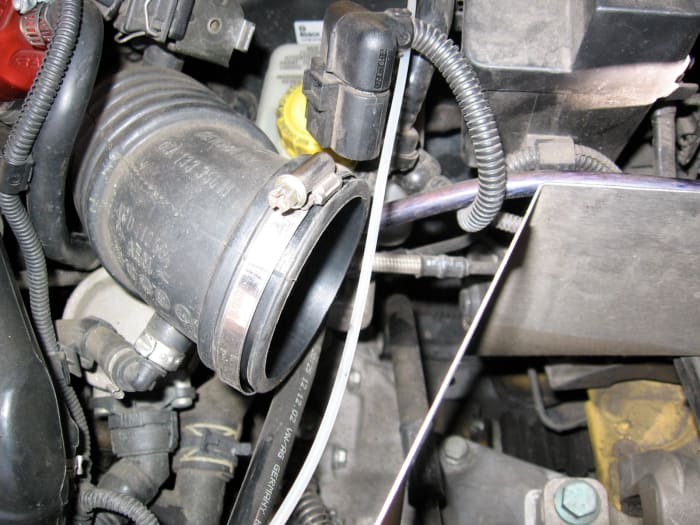 Push the large hose (TIP) off of the MAF housing and you can now completely remove the MAF from your car.