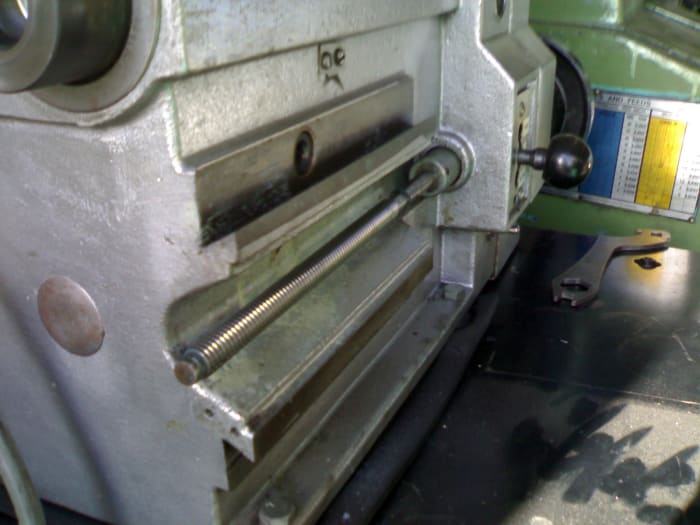 You can see the cross-feed shaft running along the body of the brake lathe. Above it is the hexagonal hole which is the drive for the disc cutter feed.