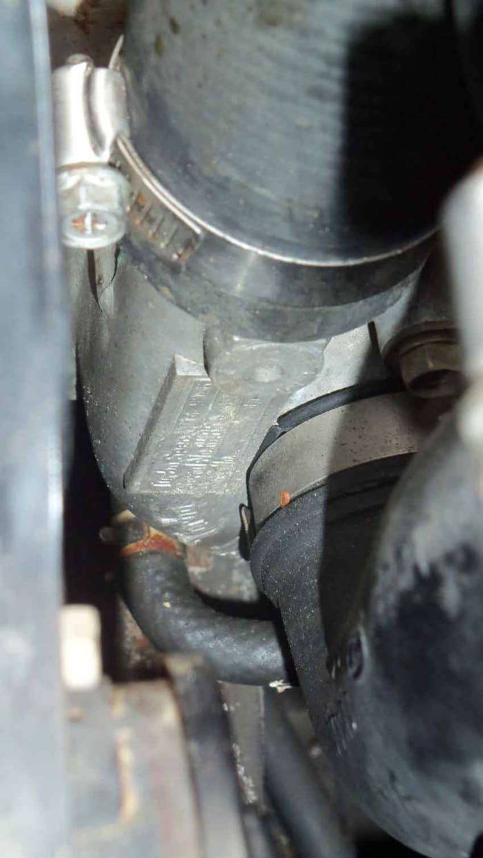 Here is the turbo. The hose off the top of photo is the exhaust, while the bigger hose beneath is the incoming air via the air cleaner.