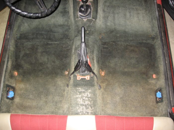 Before shot. The front seats have been removed. Seat belt tongues were masked to keep them shiny.
