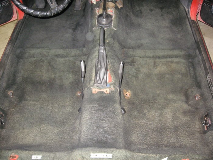 After shot. The color in the foot-wells now matches the color under the seats. The camera flash makes this look less black than it really is.