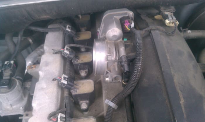 This is the throttle body in a horizontal mount. This made it harder to clean and was mounted to plastic so removal was necessary.