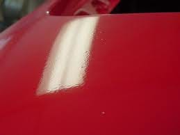 This is called "orange-peel" paint. It's a sign that the surface was not prepped properly before painting.