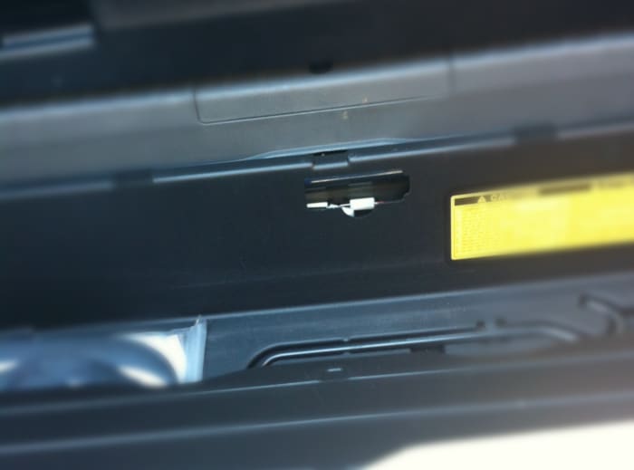 There is a plastic cover in the tool box lining that protects access to the trunk lever. Remove it. This picture is with cover removed.