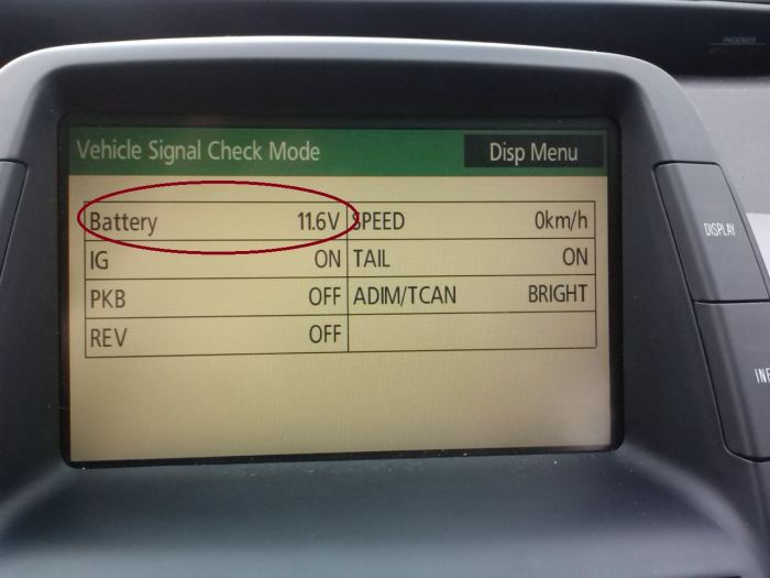 Pressing the "Power" button will put your Prius in "Accessory" mode, placing a small load/drain on the battery. Again, note the voltage.