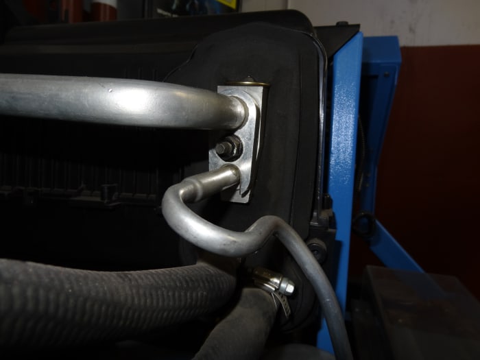 The H-Block is mounted (bolted) on the Evaporator Inlet/Outlet. The Low and High Side Lines connect to the H-Block.