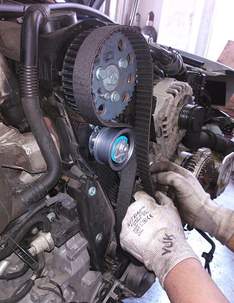 Replace the timing belt if you need to remove it to access the water pump or when it gets contaminated with coolant.