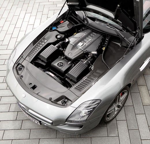The engine bay of the Mercedes Benz SLS AMG, set back and low, to keep the center of gravity as low as possible in an effort to improve handling.