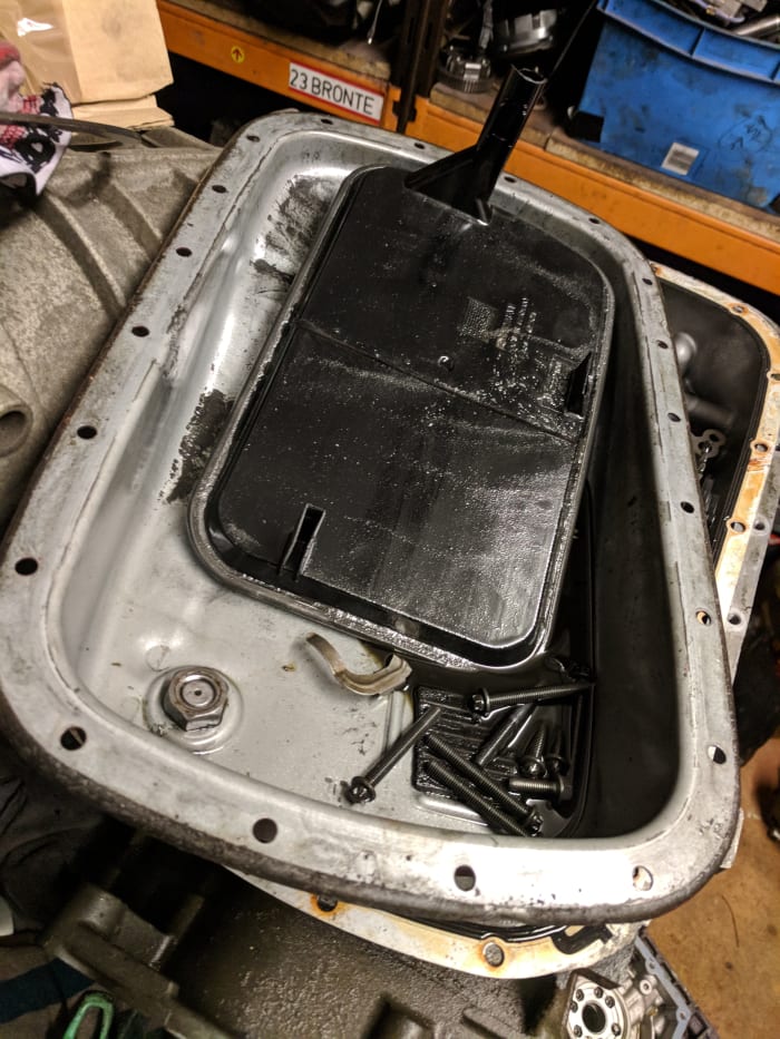 Over time, or in the event of a fault, the amount of debris in an automatic transmission can build up to a point where it blocks the filter, such as with this GM5L40E filter.