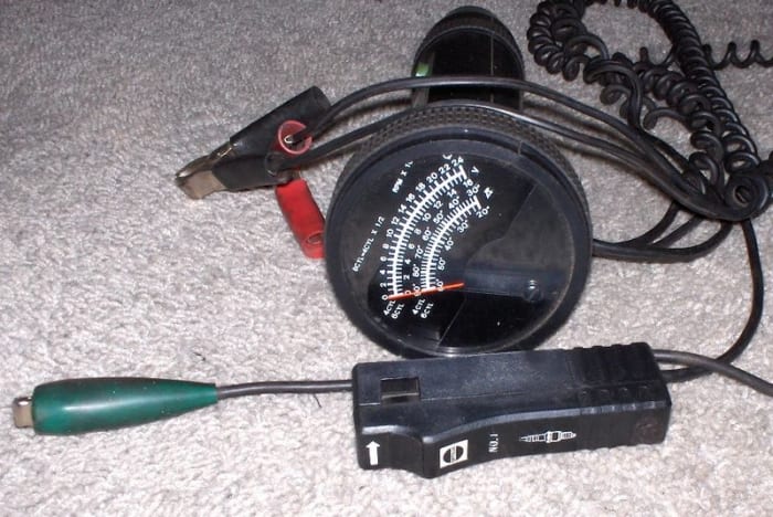 You can use a timing light to help you locate the source of engine noise. This is a timing light with integrated RPM, volt and dwell angle meter.