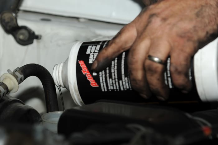 Use fresh brake fluid and the type recommended by your car manufacturer to reinstall the brake master cylinder.