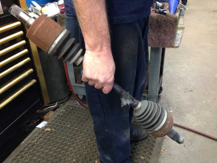 Here you can see that at both ends of the axle are CV joints. Each CV joint has its own splines. The CV joint at the top is the transmission end of the axle.