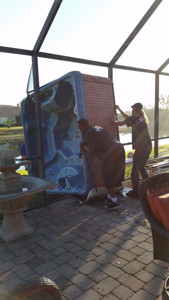 As you can see, it took 3 strong men to remove this hot tub from our screened patio.
