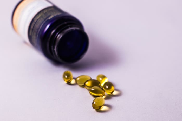 Vitamin E acts as an antioxidant, and will moisturize your dog's coat if incorporated properly into his/her diet.