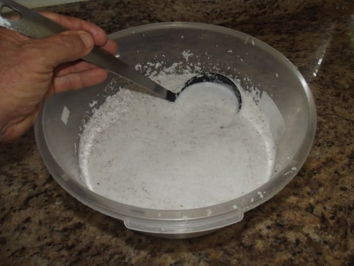 The coconut is crushed more to produce more oil.