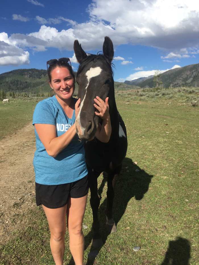 Author with a horse in it's pasture home
