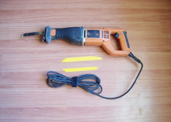 Electrically powered sawzall with wood and metal blades. (A battery operated type can come in handy sometimes.)