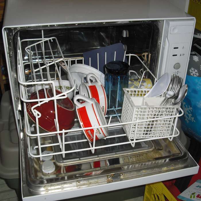 A dishwasher's many uses! Stuffed animals, plastic action figures and other toys, baseball caps, tennis shoes, and hairbrushes come out squeaky clean after a trip in the multi-practical dishwasher.