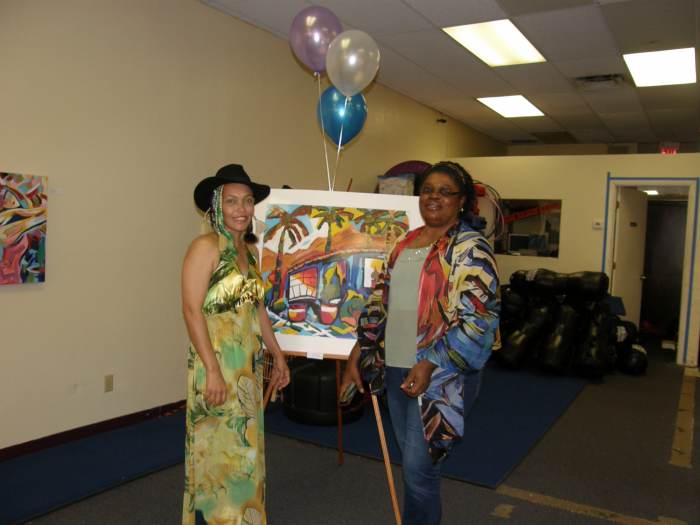 The Author and her friend, Moyaha, who is modeling one of the Author's wearable art pieces, a scarf.