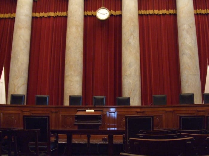 A picture of the inside of the Supreme Court where oral arguments are presented to the justices. Attorneys presenting their argument before the Court have remarked that their proximity to the nine justices is "intimate."