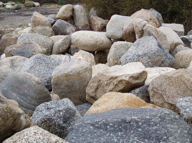 These are small rocks carried down from the mountains in Southern California. Some storms have carried down boulders weighing tons.