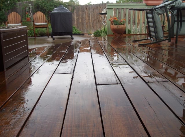 Patio weathered the storm, with chairs turned over by the owners that would otherwise have blown away .