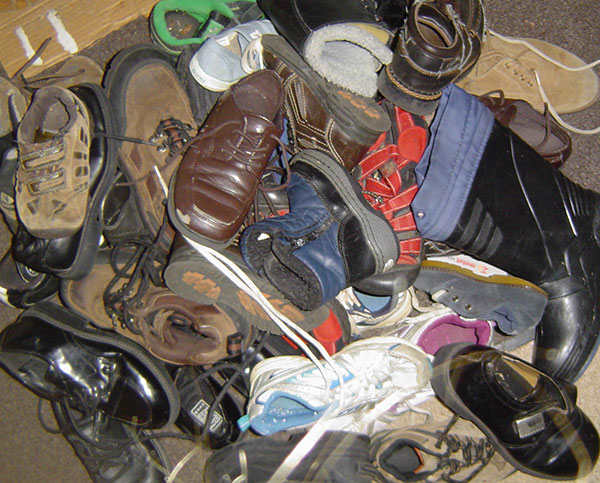 More shoes than we could use: All these shoes and boots (and probably as many more, scattered elsewhere) were given to us. Most were hand-me-downs. If any don't look "beat up", it's probably the ones we forgot to use while they fit!