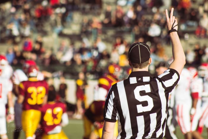 You don't have to referee other people's conflicts. (But it can sometimes be interesting to watch from the sidelines.) Managers, however, are often obligated to step in.