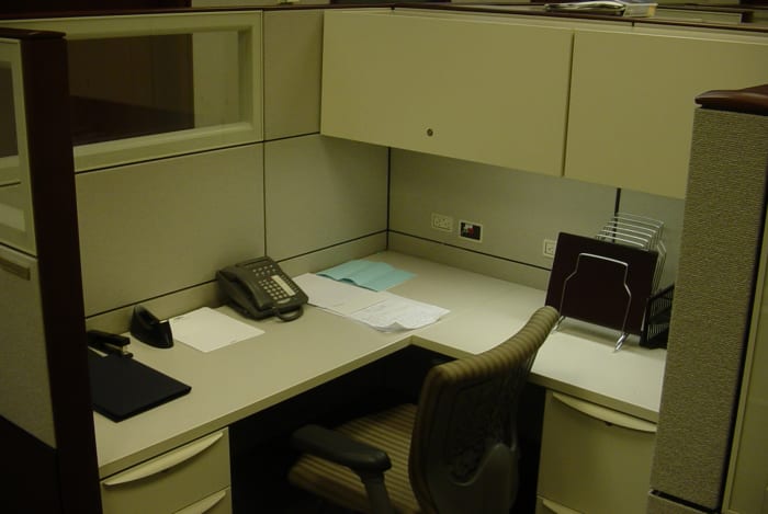 An empty piece of cubicle real estate shows little sign of its former tenant.