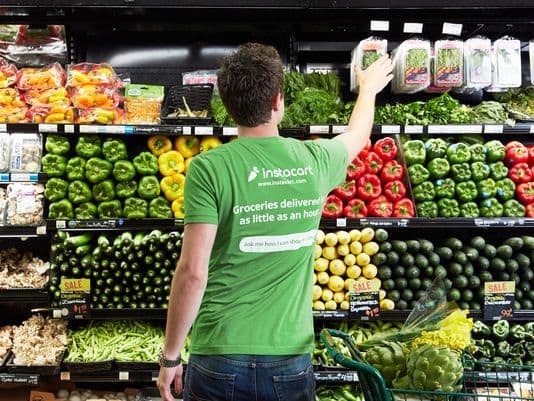 An Instacart shopper picks up the grocery items that are ordered, then delivers them directly to the customer's house.